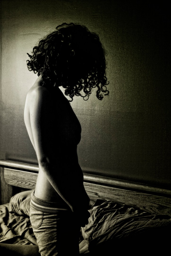 Backlit_woman_on_bed