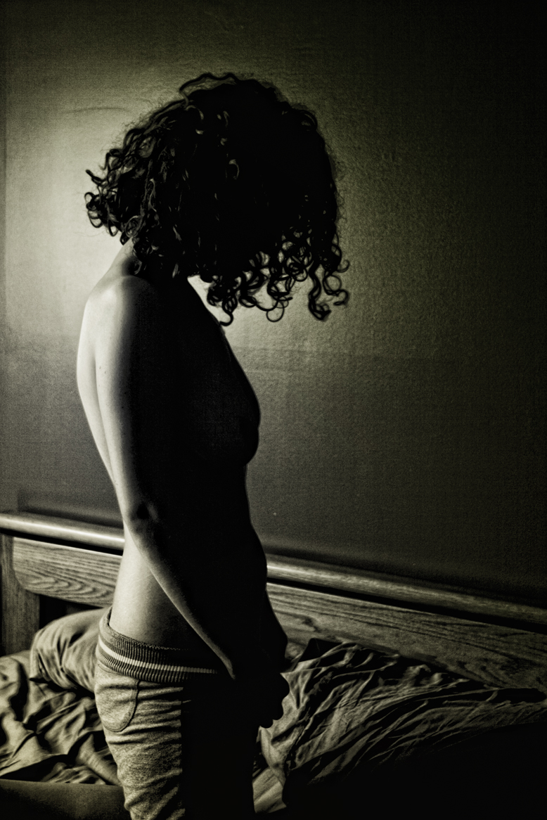 Backlit_woman_on_bed